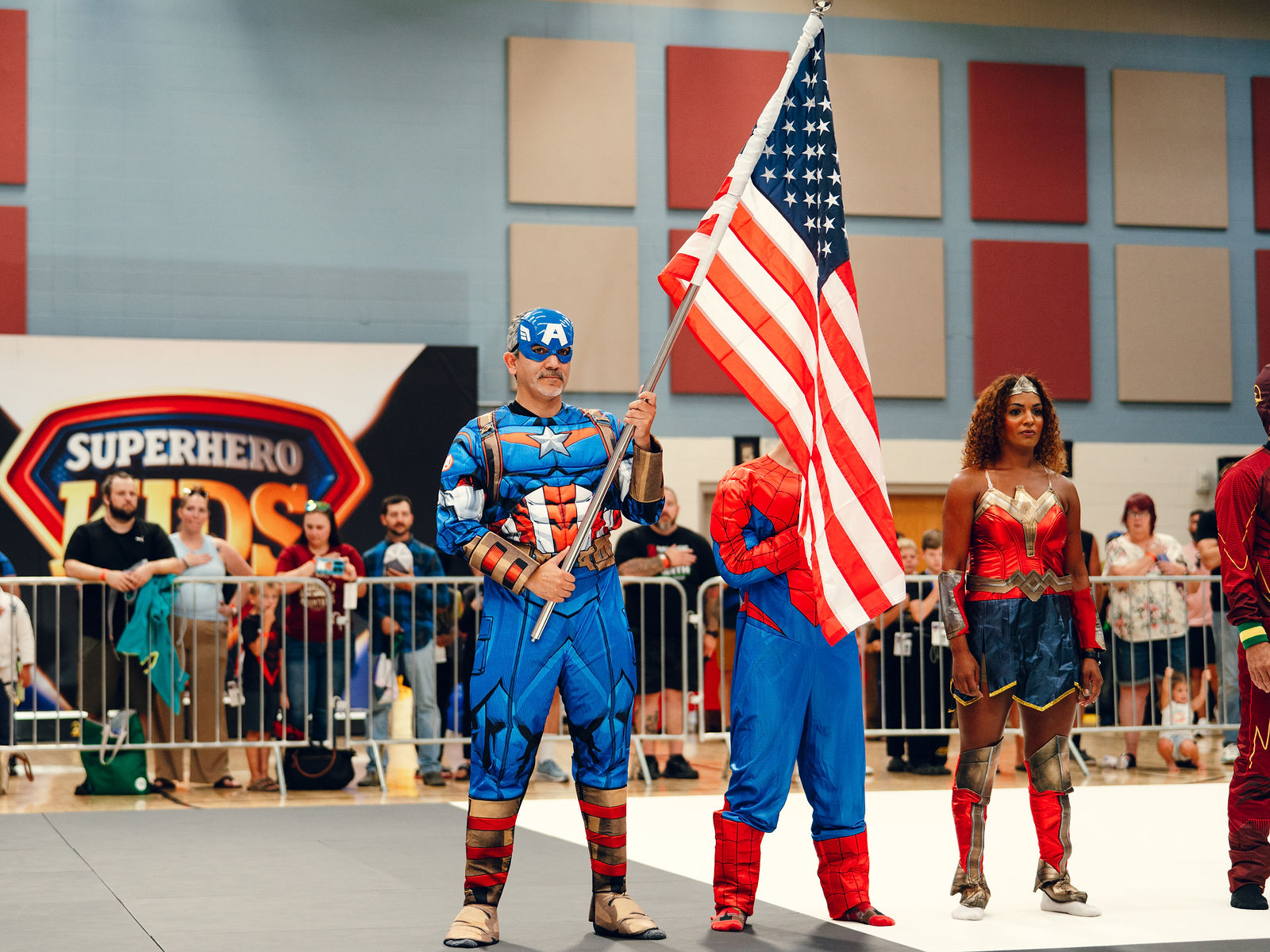 Costumed heroes opening the arena