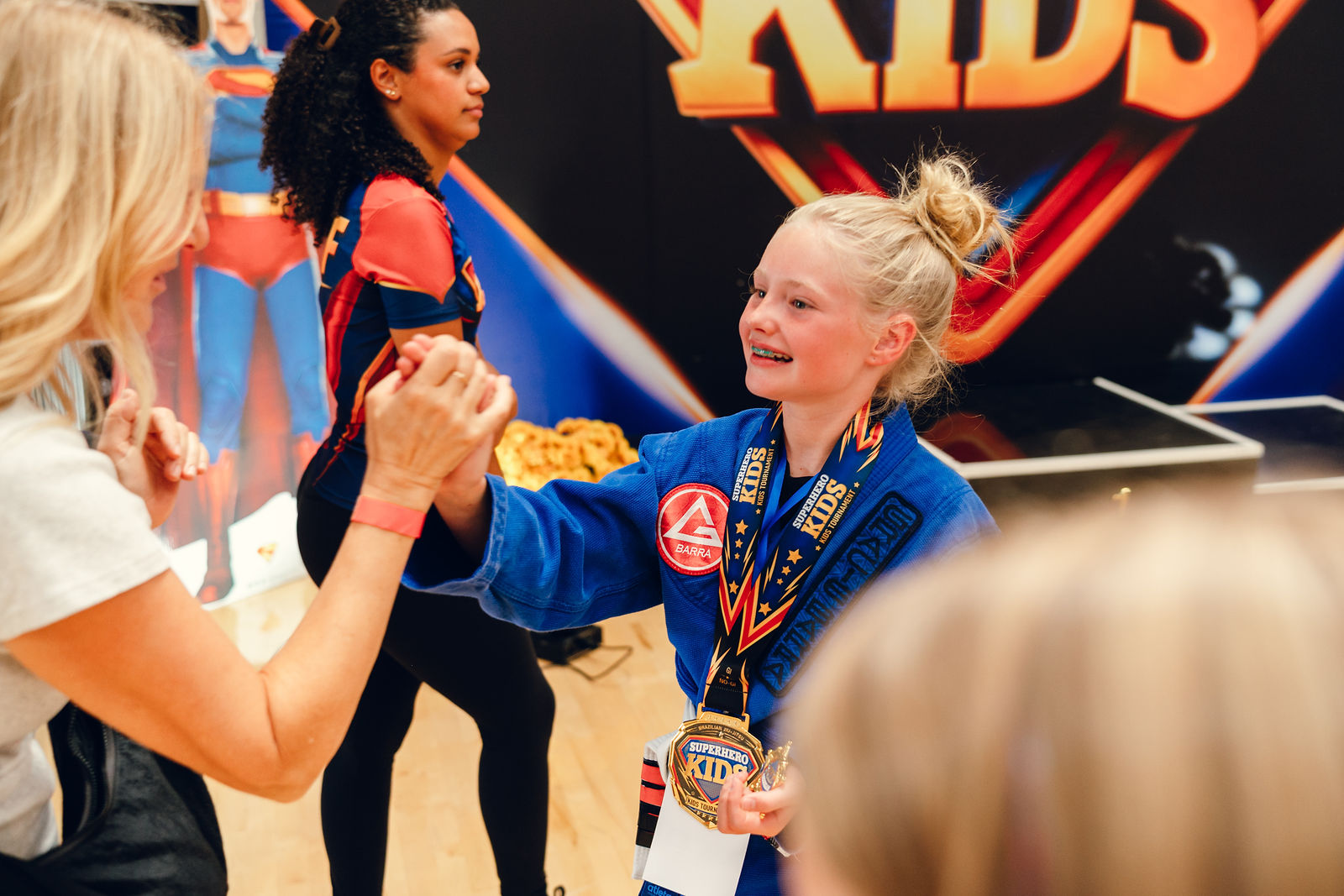 A young athlete smiling with pure joy after competing